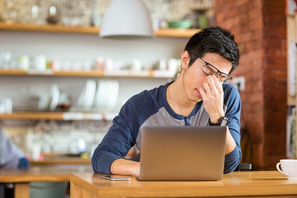 Young employee with a headache